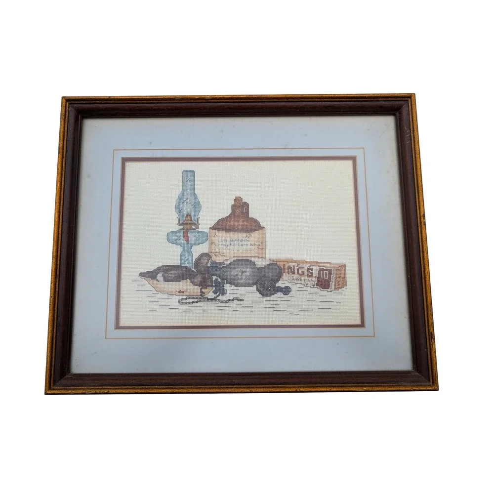 Vintage Framed Cross Stitch Duck Decoy Whiskey Jug Oil Lamp Needlepoint Art